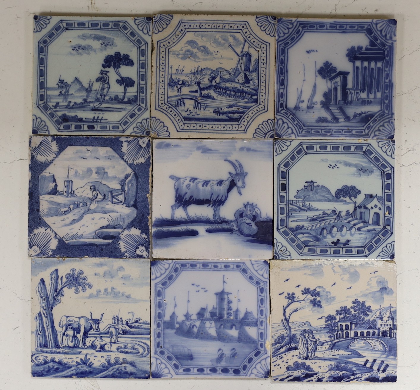 Nine various Delft blue and white landscape or animal tiles, 18th/19th century